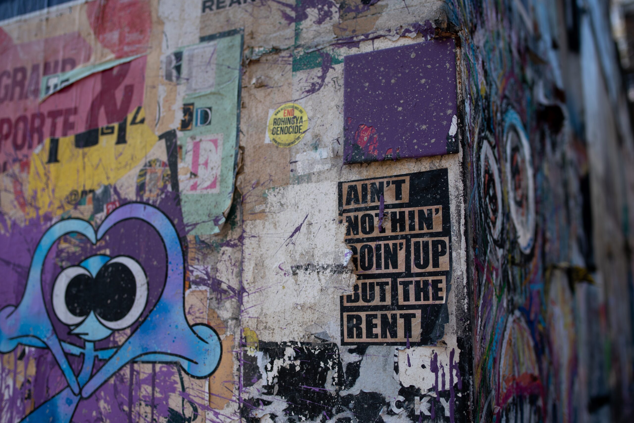 purple, blue, and black graffiti wall