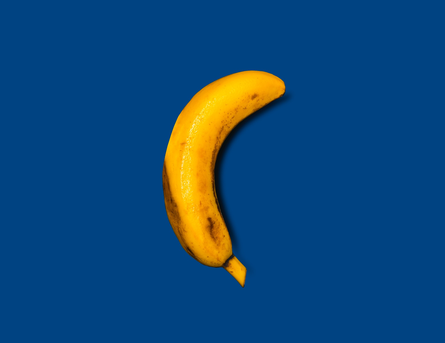 yellow banana on blue background